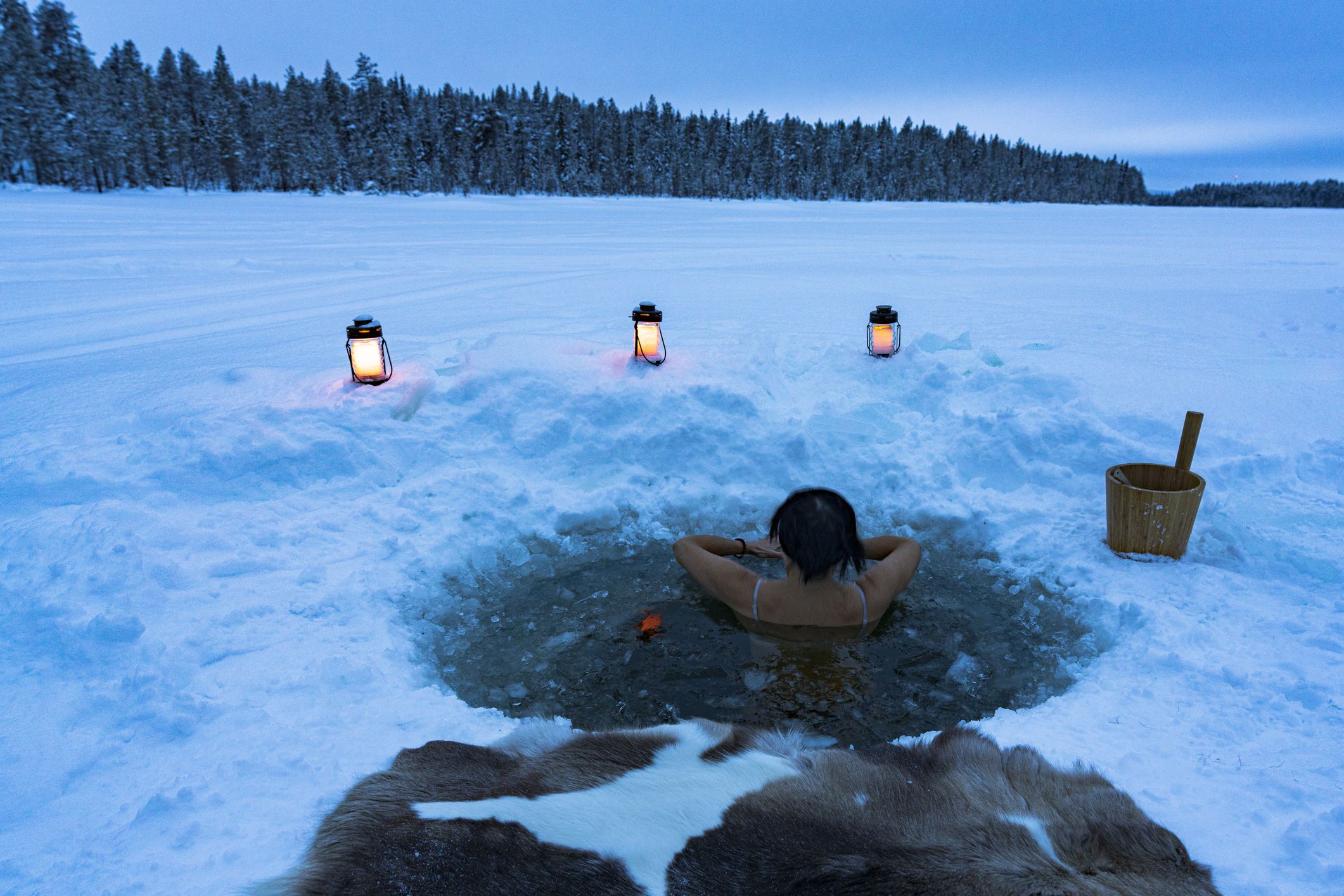 woman-enjoying-cold-baths-in-a-ice-hole